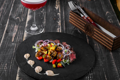 High angle view of fruits in plate on table