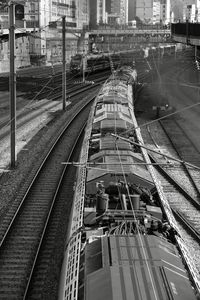 High angle view of railroad tracks amidst buildings in city