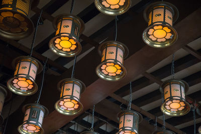 Low angle view of illuminated lanterns hanging in row