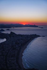 Scenic view of sea against sky at dusk