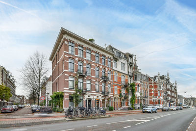 Buildings in city against sky