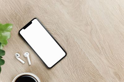 High angle view of smart phone on table