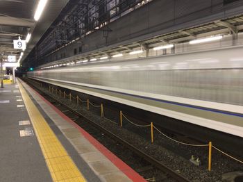 Train at railroad station at night