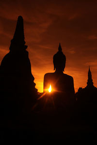 Silhouette of temple at sunset