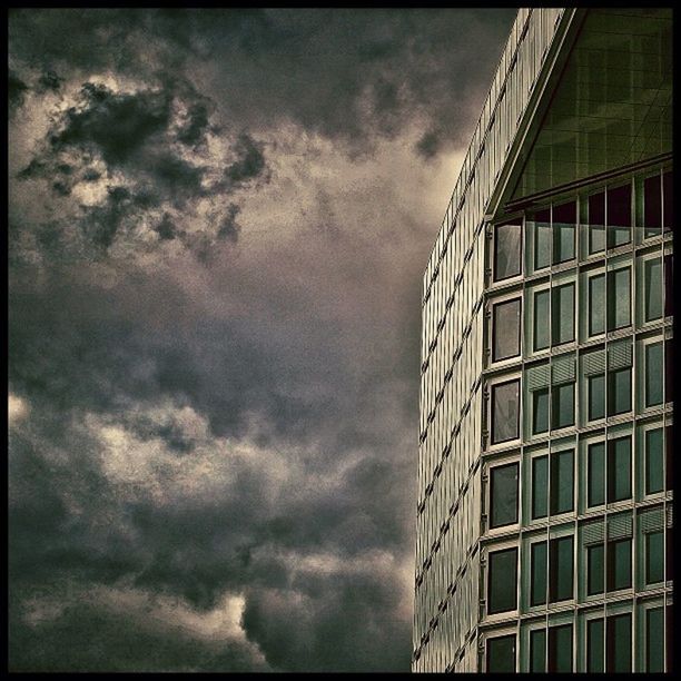 sky, cloud - sky, low angle view, cloudy, architecture, built structure, building exterior, overcast, weather, transfer print, storm cloud, auto post production filter, cloud, city, building, outdoors, cloudscape, no people, dusk, day