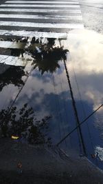 Reflection of sky on puddle