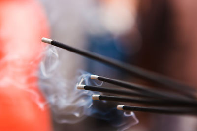 Close-up of incense stick in temple