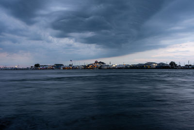 Scenic view of sea against sky at dusk