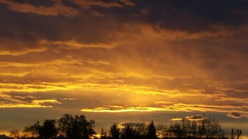 Scenic view of dramatic sky during sunset