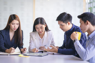 Group of people sitting in the table