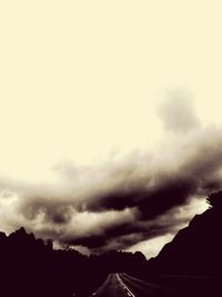 Scenic view of silhouette mountain against sky during winter