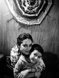 Portrait of young couple sitting at home