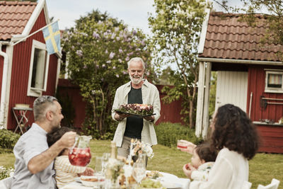 Full length of father and daughter on table