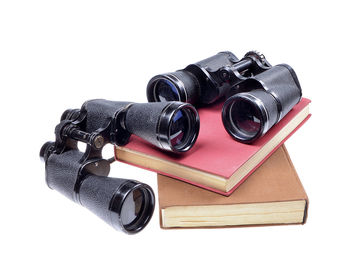 Close-up of black camera over white background