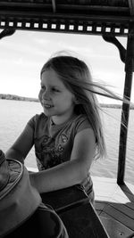 Portrait of a girl sitting on boat