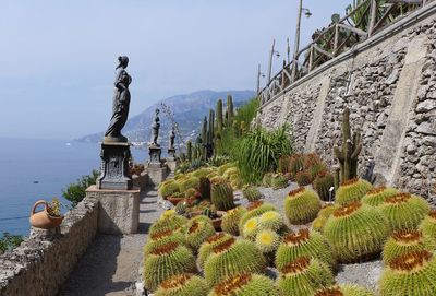 Statue on mountain against sky