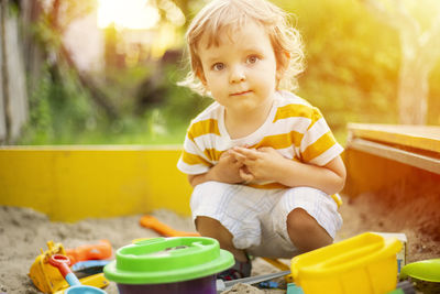 Portrait of cute girl sitting on table