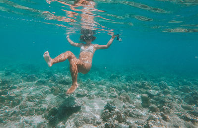 Woman swimming in sea