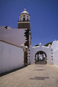 View of historical building against clear blue sky