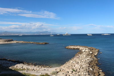 Scenic view of sea against blue sky