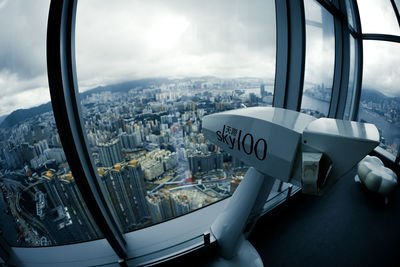 Aerial view of cityscape seen through window