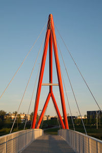 View of suspension bridge against blue sky