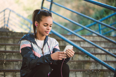 Young woman using mobile phone