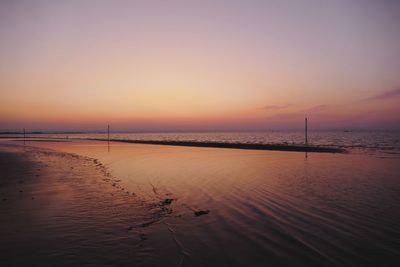 Scenic view of sea against sky at sunset