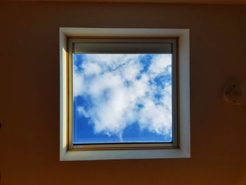 Low angle view of sky seen through window