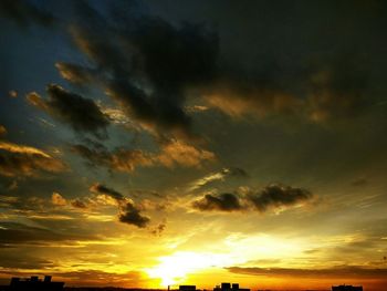 Low angle view of dramatic sky at sunset