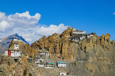 Panoramic view of buildings in city against sky