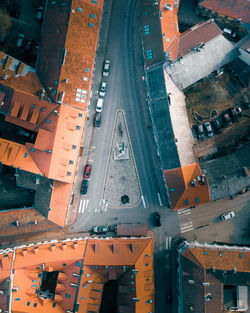 Aerial view of road by houses in town