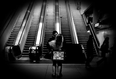 Rear view of men on steps
