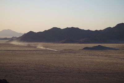 Scenic view of desert against clear sky