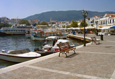 View of boats moored at harbor in town