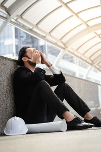 Young man sitting at home