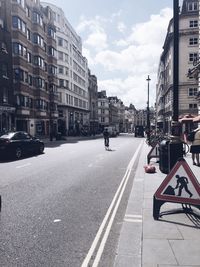 Road in city against sky