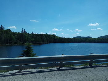Scenic view of lake against blue sky