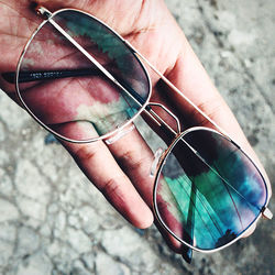 Close-up of hand holding eyeglasses