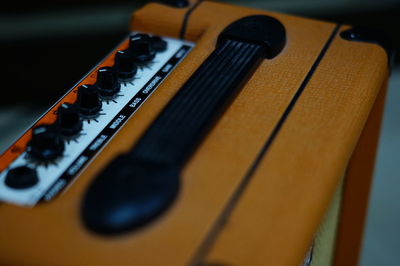 Close-up of guitar on table