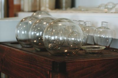 Close-up of wine glasses on table