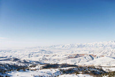 Panorama of the tien shan mountains covered with snow in sunny weather. winter landscape