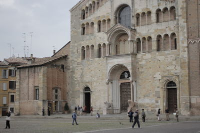 Group of people in front of historic building