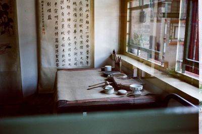 Open book on window sill at home