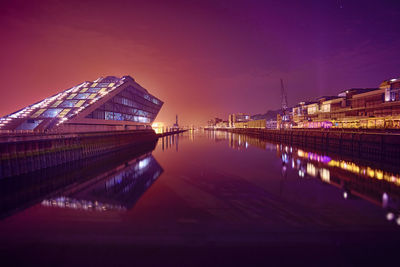 Reflection of illuminated buildings in water