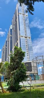 Low angle view of modern buildings against sky