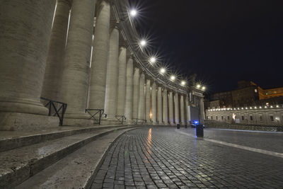 Illuminated city against sky at night