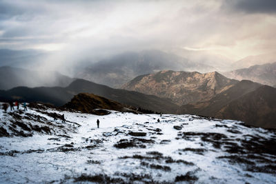 Scenic view of snowcapped mountains against sky