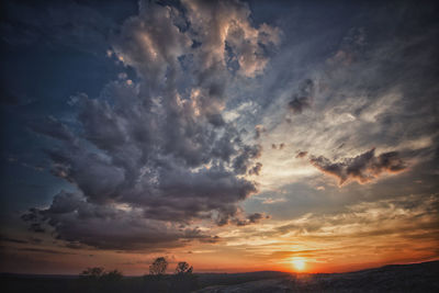 Scenic view of dramatic sky during sunset