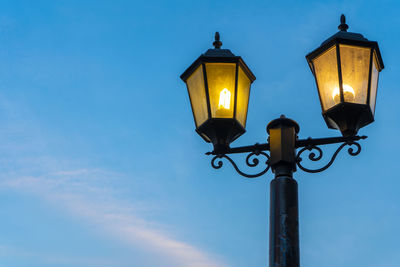 Low angle view of illuminated street light